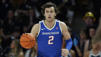 Tyson Degenhart of the Boise State Broncos brings the ball up the court against the Utah State Aggies, and we offer our top Colorado vs. Boise State prediction based on the best March Madness odds.
