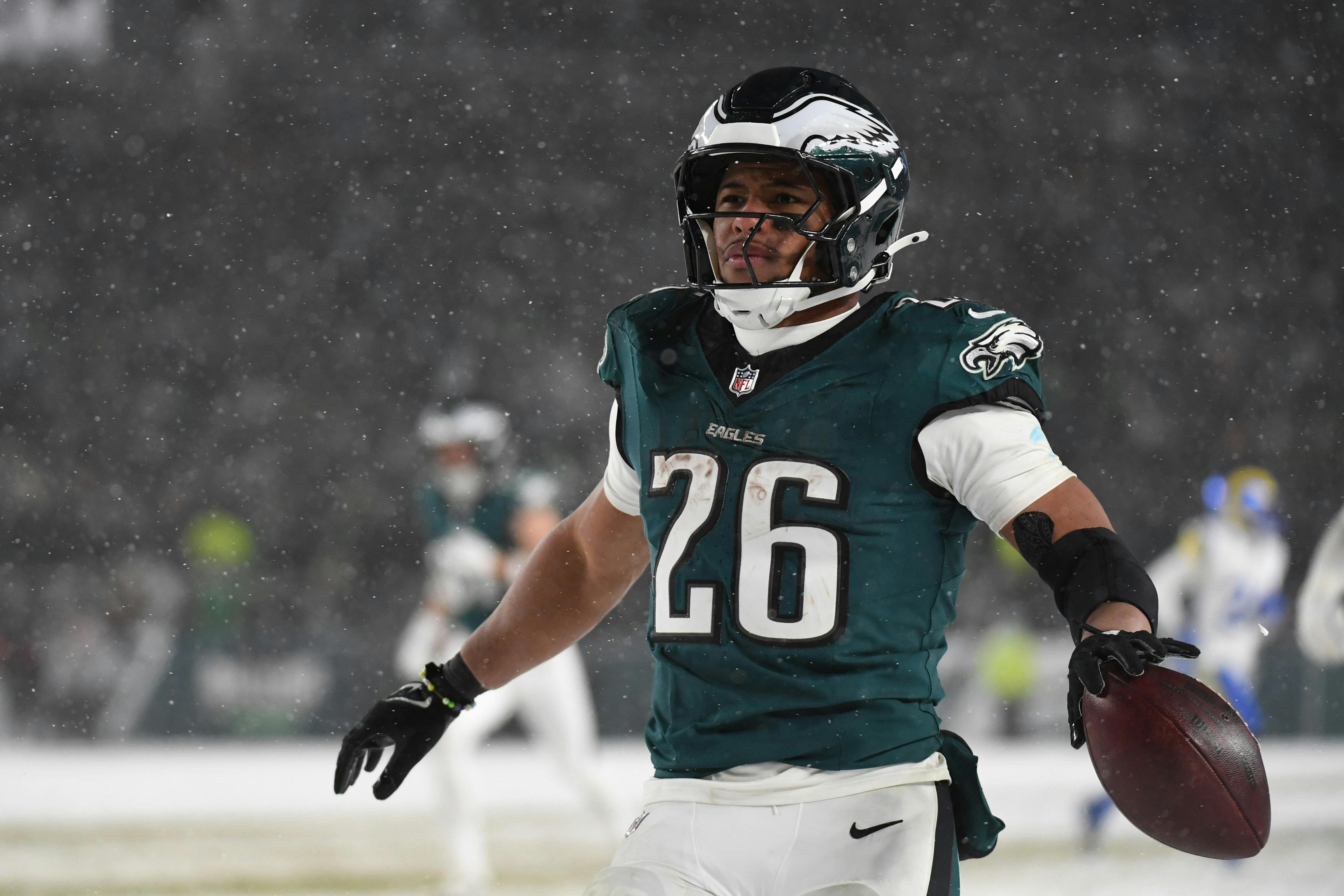 Philadelphia Eagles running back Saquon Barkley celebrates as we make our Super Bowl predictions and offer our pick to win Super Bowl 59.