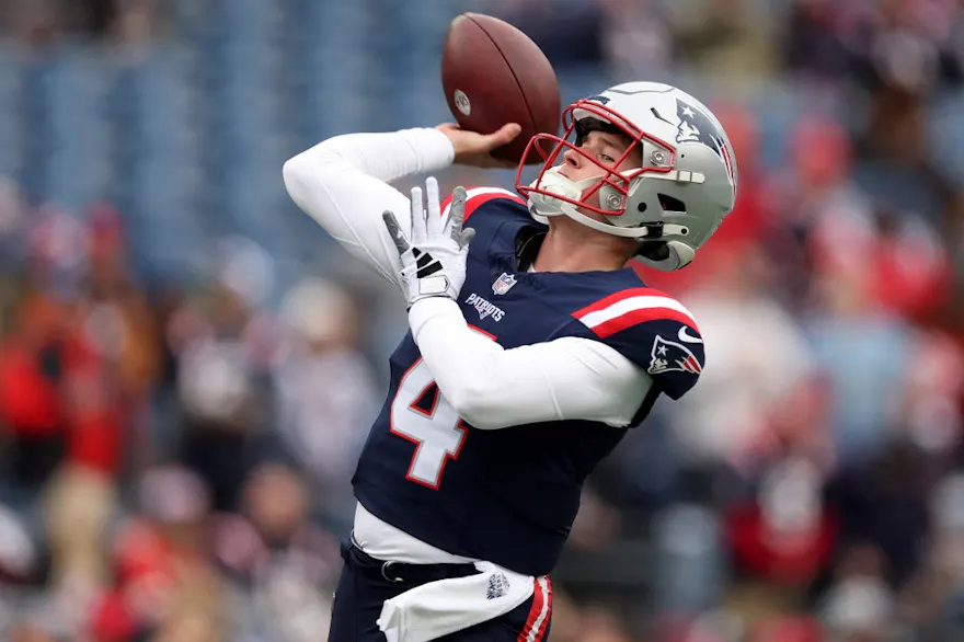 Bailey Zappe of the New England Patriots warms up ahead of our Week 16 NFL predictions for Patriots vs. Broncos