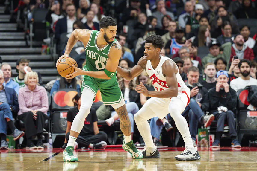 Boston Celtics forward Jayson Tatum guards the ball against Toronto Raptors guard Ochai Agbaji as we look at the FanDuel NBA League Pass promotion.