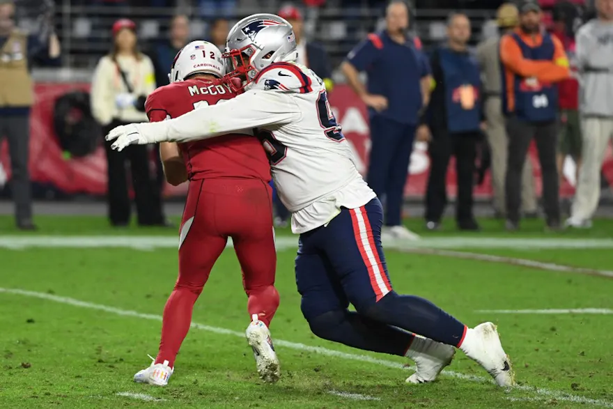 Daniel Ekuale of the New England Patriots sacks Colt McCoy of the Arizona Cardinals at State Farm Stadium on Dec. 12, 2022 in Glendale, Arizona. 