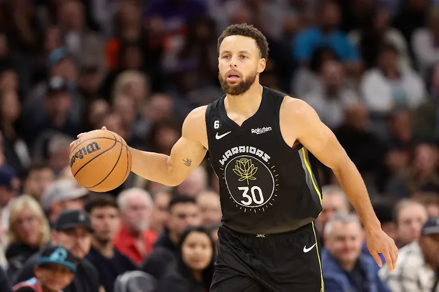 Stephen Curry #30 of the Golden State Warriors handles the ball during the first half of the NBA game at Footprint Center on November 16, 2022 in Phoenix, Arizona.