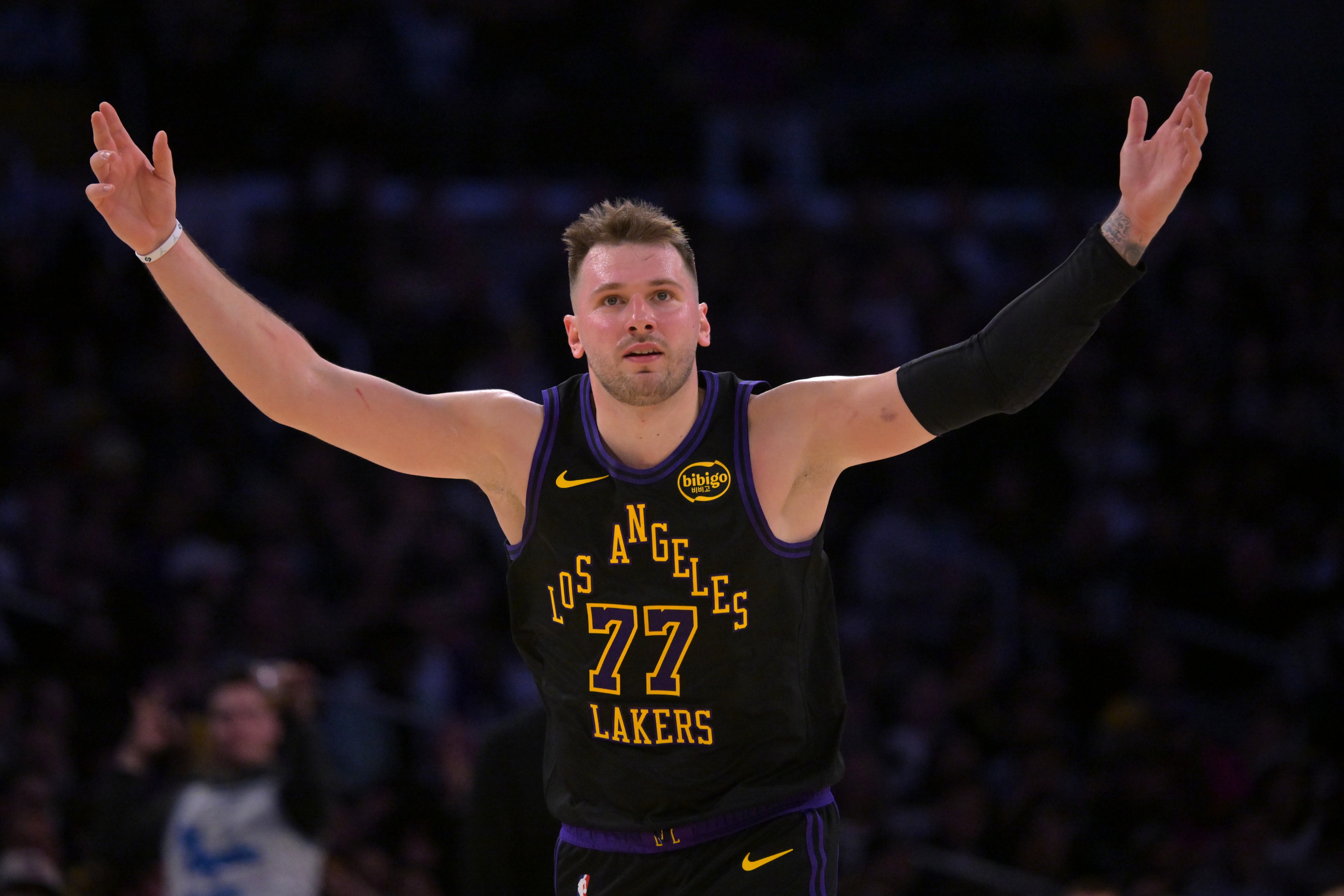 Los Angeles Lakers guard Luka Doncic (77), seen here reacting after a made 3-pointer, leads our Lakers vs. Spurs player props tonight.