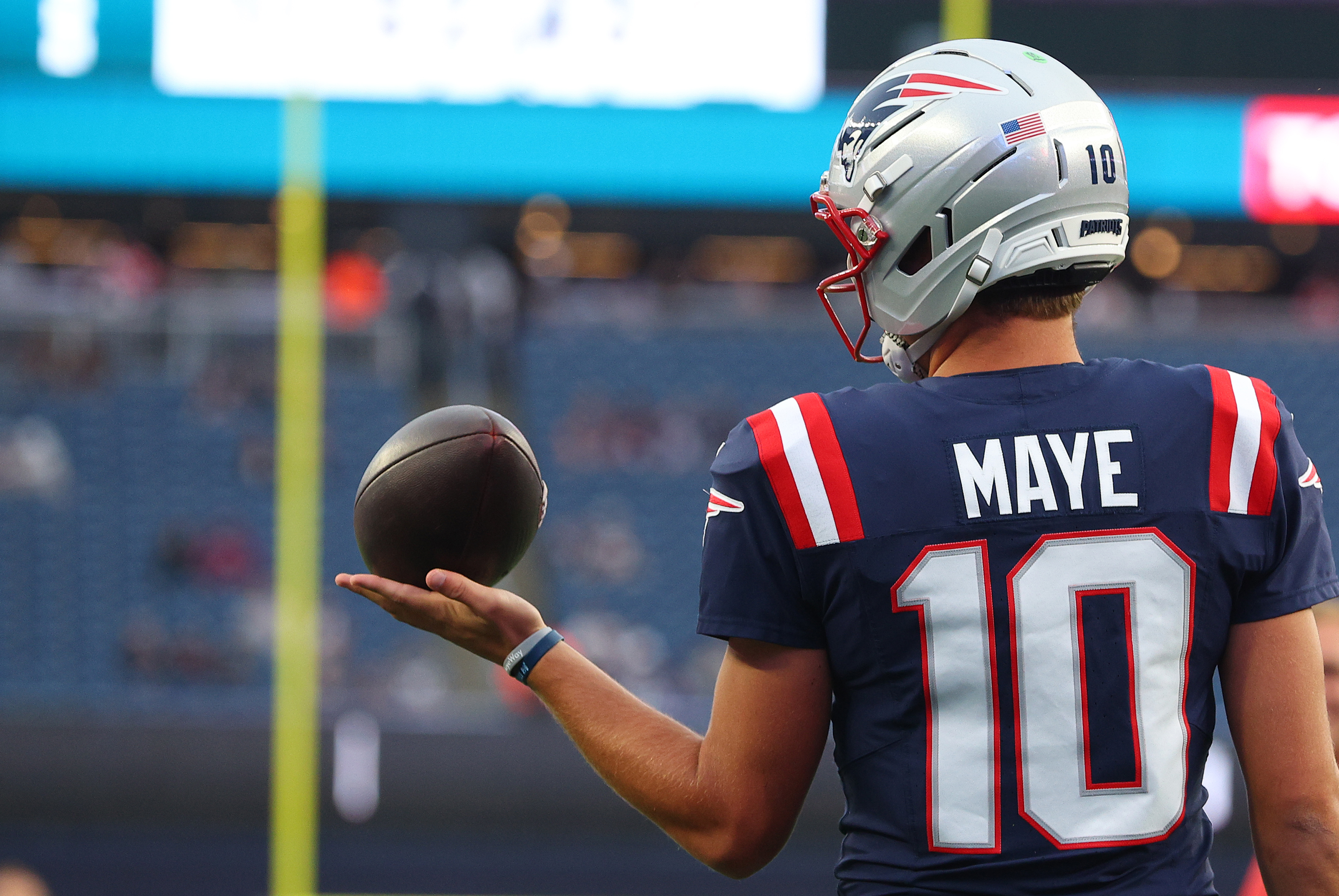New England Patriots quarterback Drake Maye (10) warms up as he is featured in our Patriots vs. Seahawks prediction & opening odds.