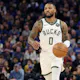 Damian Lillard of the Milwaukee Bucks dribbles the ball against the Golden State Warriors at Chase Center as we look at out Bucks-Pelicans NBA player props.