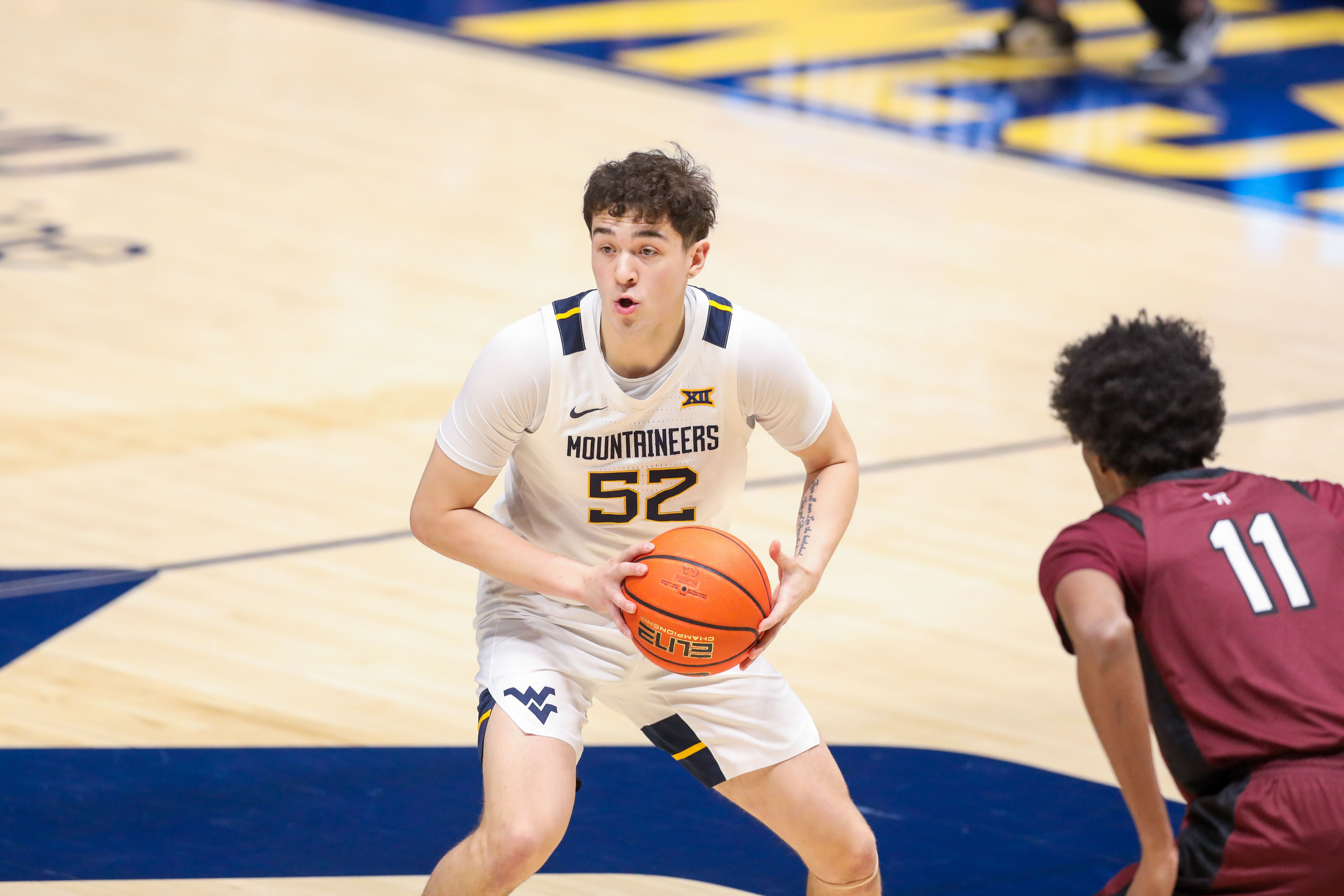 West Virginia Mountaineers guard Treysen Eaglestaff passes the ball as we offer our college basketball best bets today