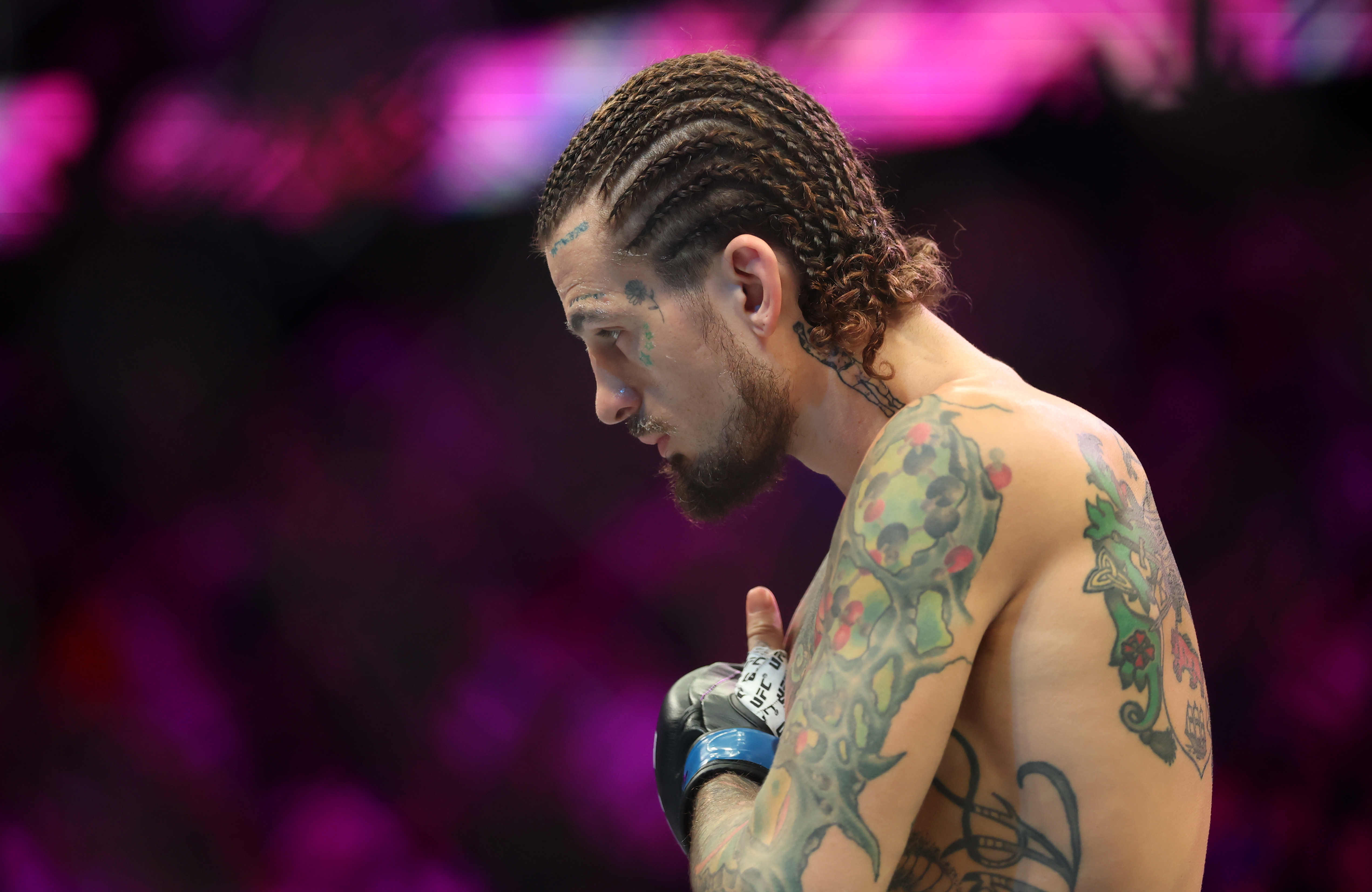 Sean O’Malley (blue gloves) prepares to fight as we dive into our Sean O’Malley vs. Song Yadong prediction.