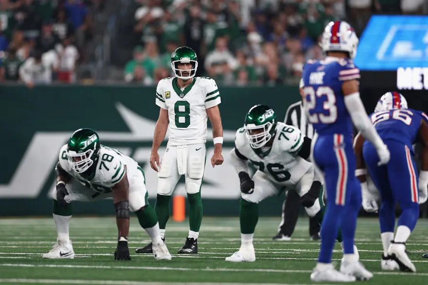 Quarterback Aaron Rodgers of the New York Jets prepares to snap the football during the first quarter the against the Buffalo Bills. Rodgers opened as the favorite by the 2024-25 NFL Comeback Player of the Year Odds.