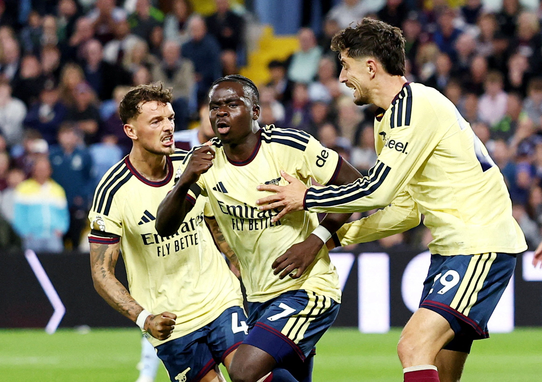 Bukayo Saka celebrating a goal as we break down our Arsenal vs. Chelsea prediction. Photo by REUTERS/David Klein.