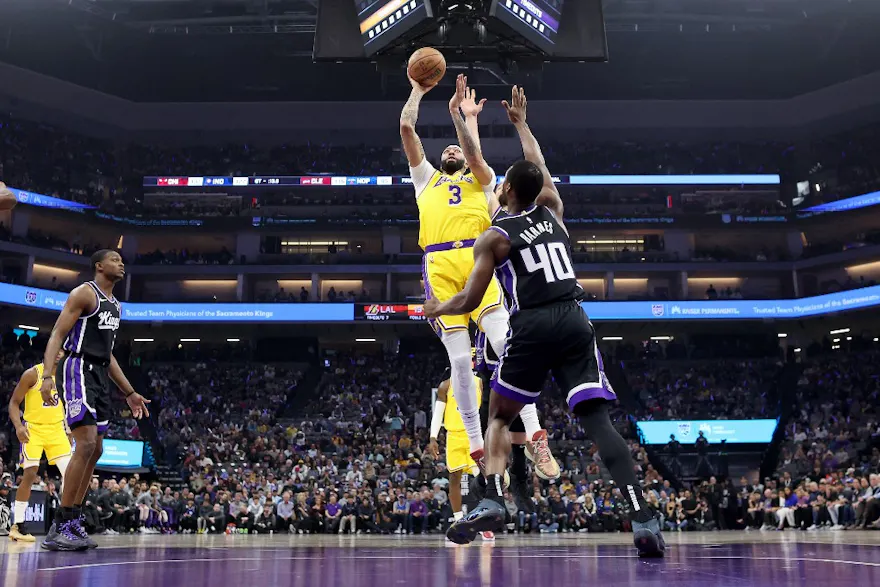 Anthony Davis of the Los Angeles Lakers shoots over Harrison Barnes of the Sacramento Kings. We're expecting Davis to have a big night in our Warriors vs. Lakers NBA player props