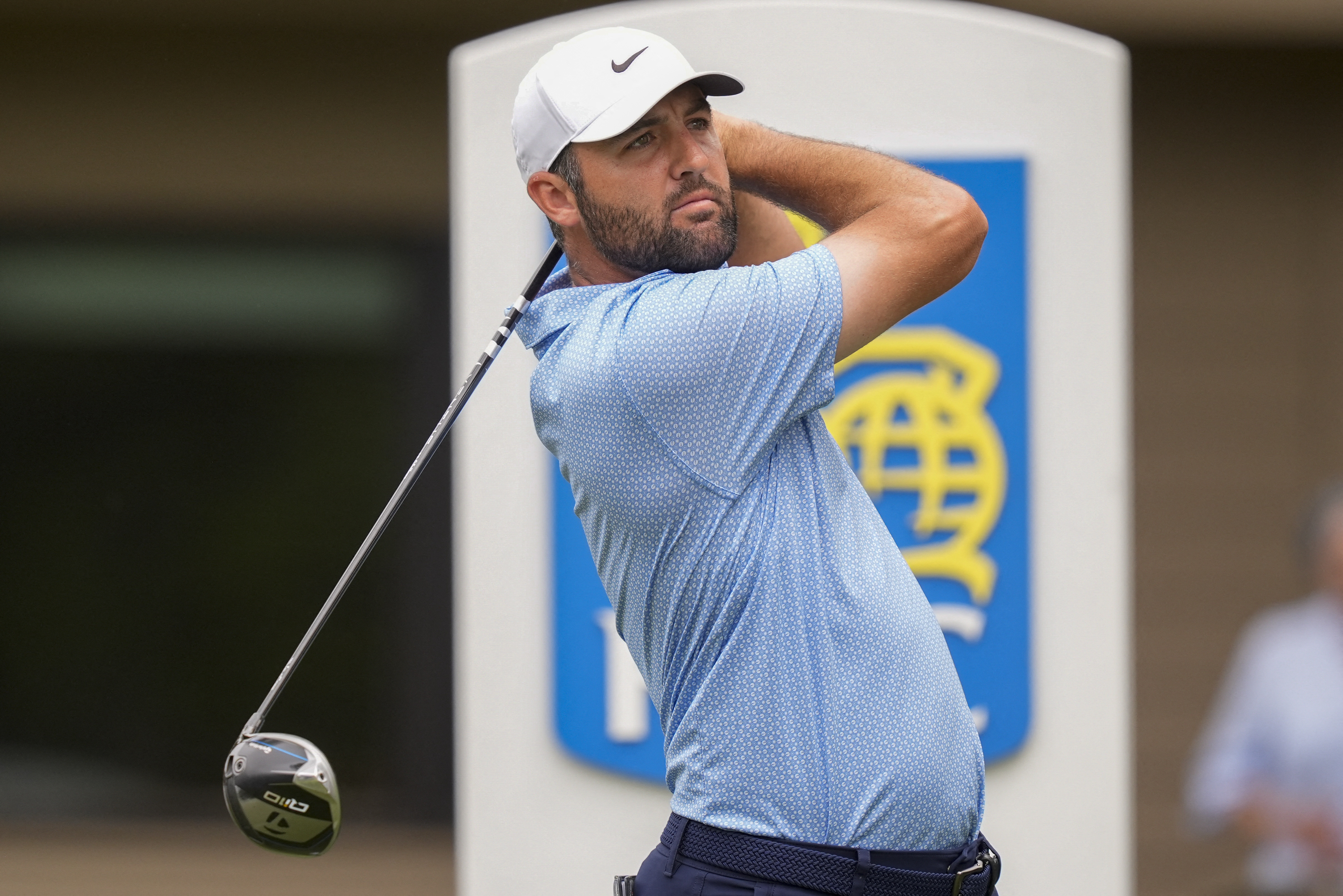 Scottie Scheffler drives the ball as we break down our Cadillac Championship odds.