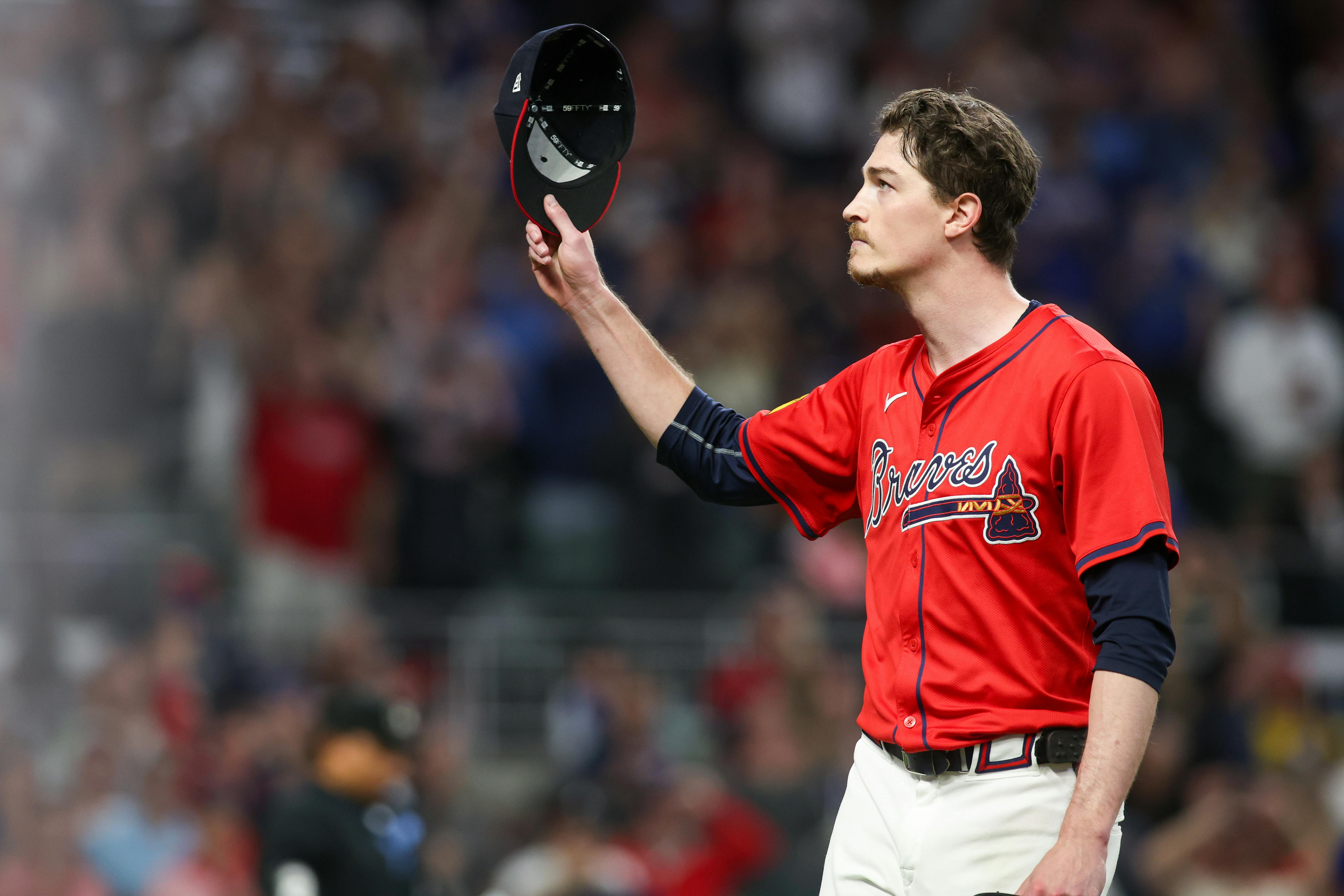 Atlanta Braves starting pitcher Max Fried tips his hat to the crowd after being removed from a game against the Kansas City Royals, and he