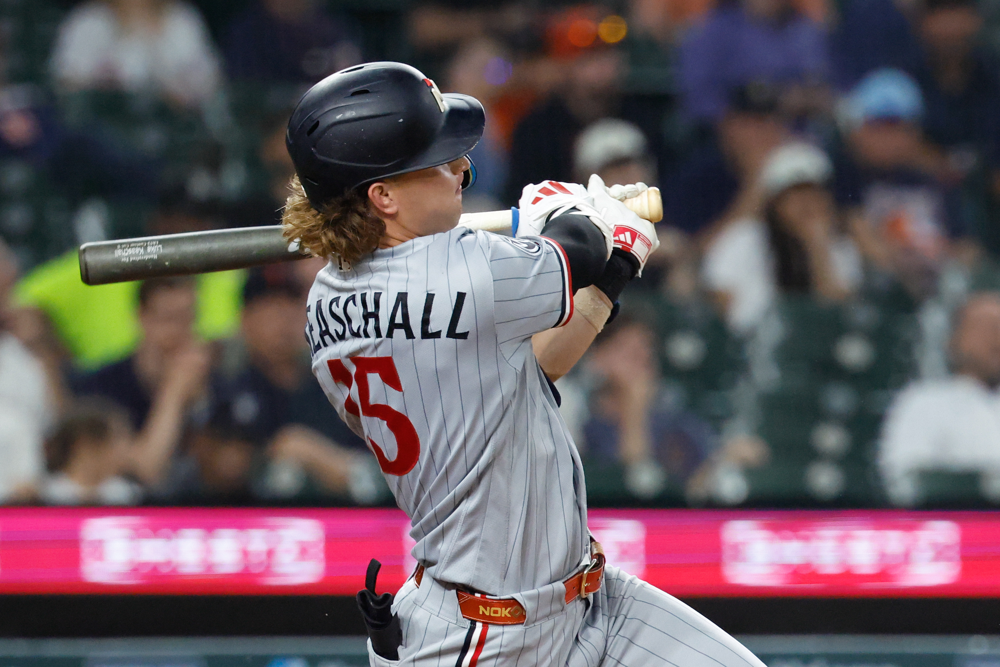 Minnesota Twins second baseman Luke Keaschall (15) hits a single as he is featured in our Twins vs. Diamondbacks prediction & pick.