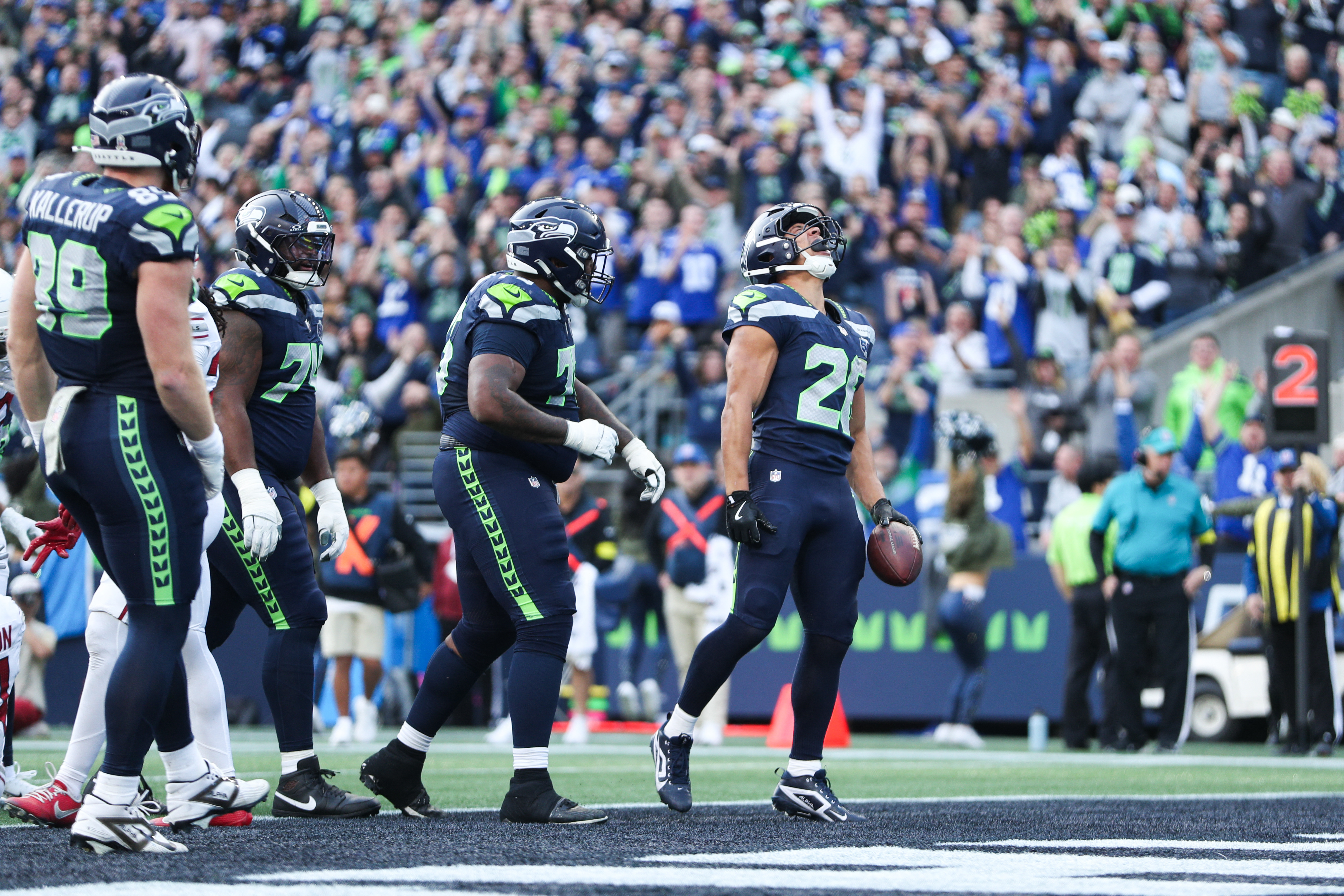 Seattle Seahawks running back Zach Charbonnet (26) celebrates after scoring a touchdown during as we look at our 49ers vs. Seahawks weather report