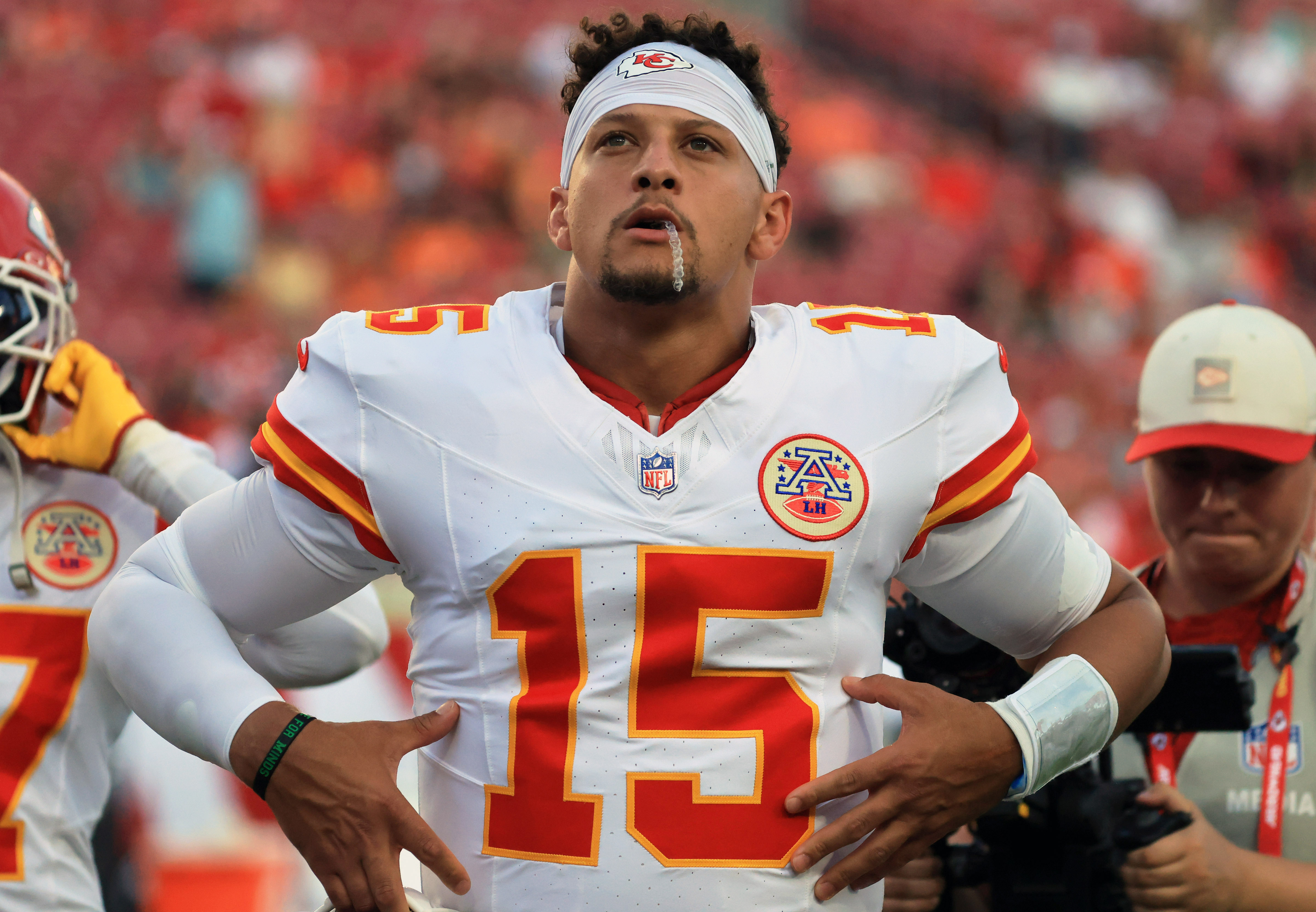 Kansas City Chiefs quarterback Patrick Mahomes (15) flexes as he is featured in our NFL win totals.