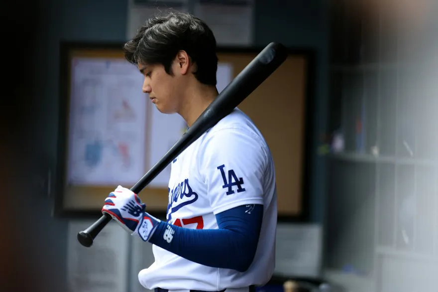 Shohei Ohtani of the Los Angeles Dodgers looks on from the dugout during a game against the St. Louis Cardinals, and we offer our top Shohei Ohtani player props based on the best MLB odds.