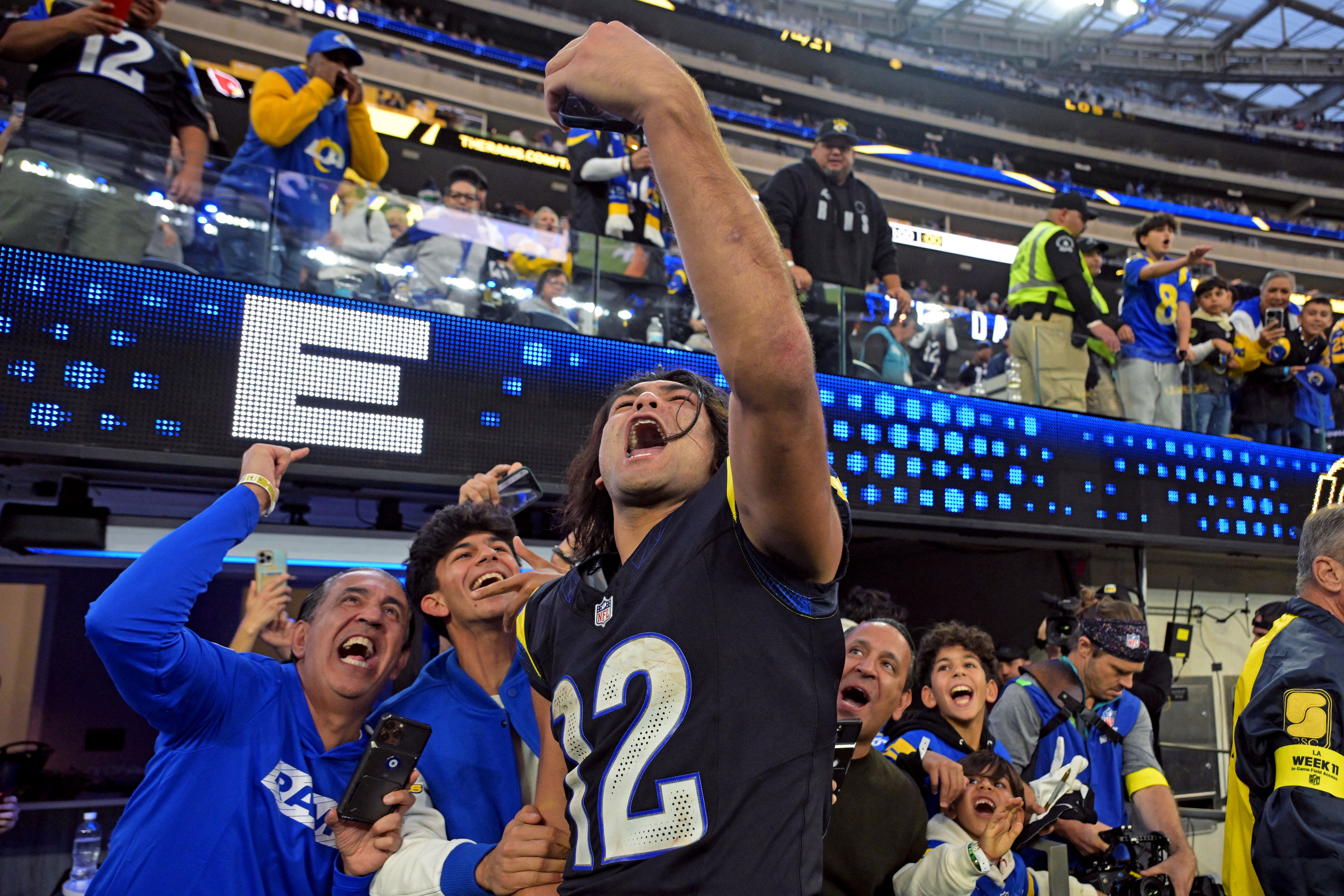 Los Angeles Rams wide receiver Puka Nacua (12) takes a selfie video as we offer our NFC Championship Game bingo cards for Rams vs. Seahawks.