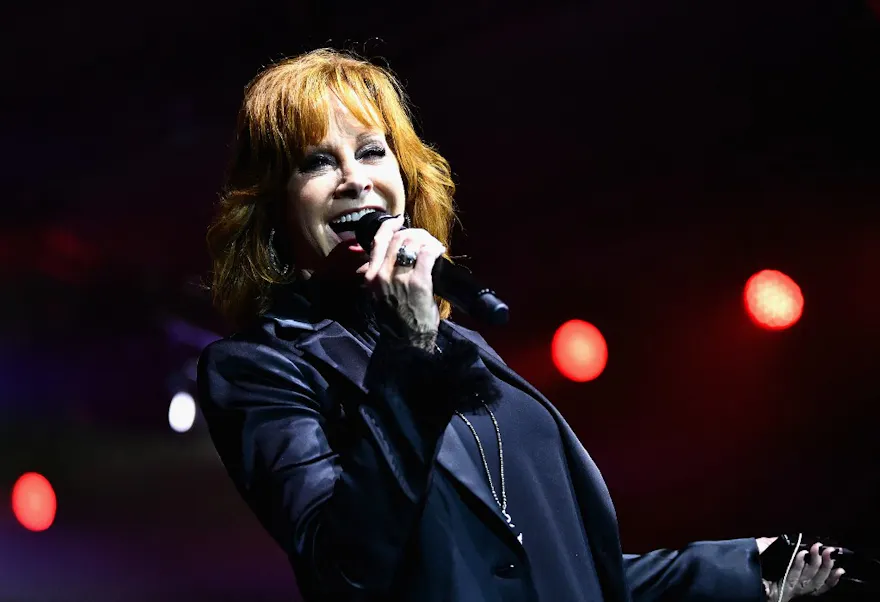 Reba McEntire performs onstage as we look at the Super Bowl 2024 national anthem odds