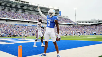 Barion Brown of the Kentucky Wildcats celebrates after scoring a touchdown against the EKU Colonels.