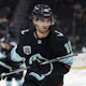 Seattle Kraken center Matty Beniers warms up by bouncing a puck on the blade of his stick as we look at our best odds and picks to win the Calder Trophy.