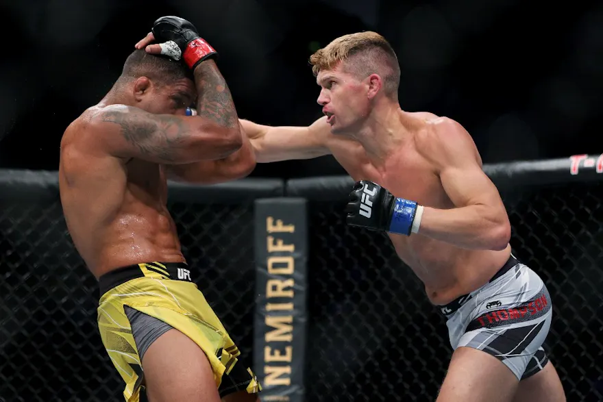 Stephen Thompson (R) lands a punch on Gilbert Burns of Brazil in the second round in their welterweight bout during UFC 264: Poirier v McGregor 3 at T-Mobile Arena on July 10, 2021.