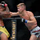 Stephen Thompson (R) lands a punch on Gilbert Burns of Brazil in the second round in their welterweight bout during UFC 264: Poirier v McGregor 3 at T-Mobile Arena on July 10, 2021.