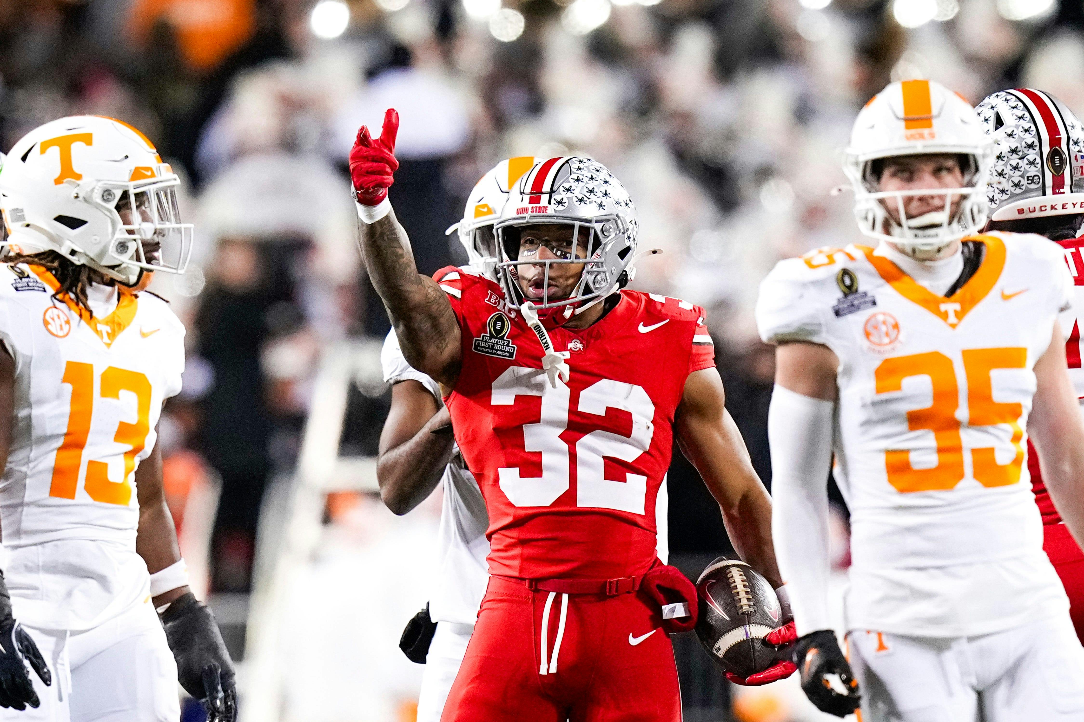 Ohio State Buckeyes running back TreVeyon Henderson celebrates as we break down the college football championship odds.