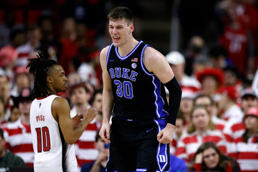 Kyle Filipowski of the Duke Blue Devils reacts following a basket during the second half of the game against the NC State Wolfpack as we look at our James Madison-Duke prediction.