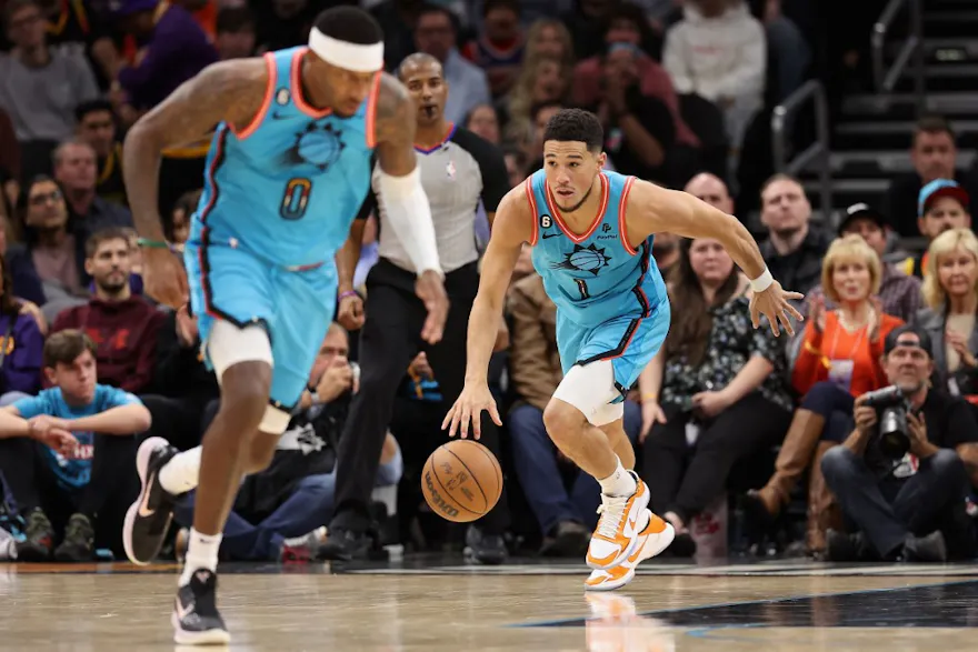 Devin Booker #1 of the Phoenix Suns handles the ball during the first half of the NBA game against the Los Angeles Lakers at Footprint Center on Nov. 22. 