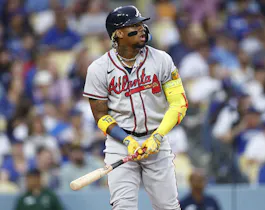Ronald Acuna Jr. #13 of the Atlanta Braves hits a home run against the Los Angeles Dodgers, and we offer our top odds and predictions for the 2023 MLB MVP awards.