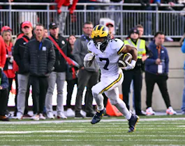 Donovan Edwards #7 of the Michigan Wolverines runs with the ball during the fourth quarter of a game against the Ohio State Buckeyes at Ohio Stadium on Nov. 26. 