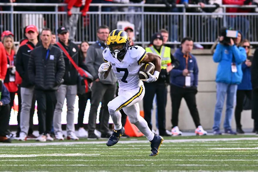 Donovan Edwards #7 of the Michigan Wolverines runs with the ball during the fourth quarter of a game against the Ohio State Buckeyes at Ohio Stadium on Nov. 26. 