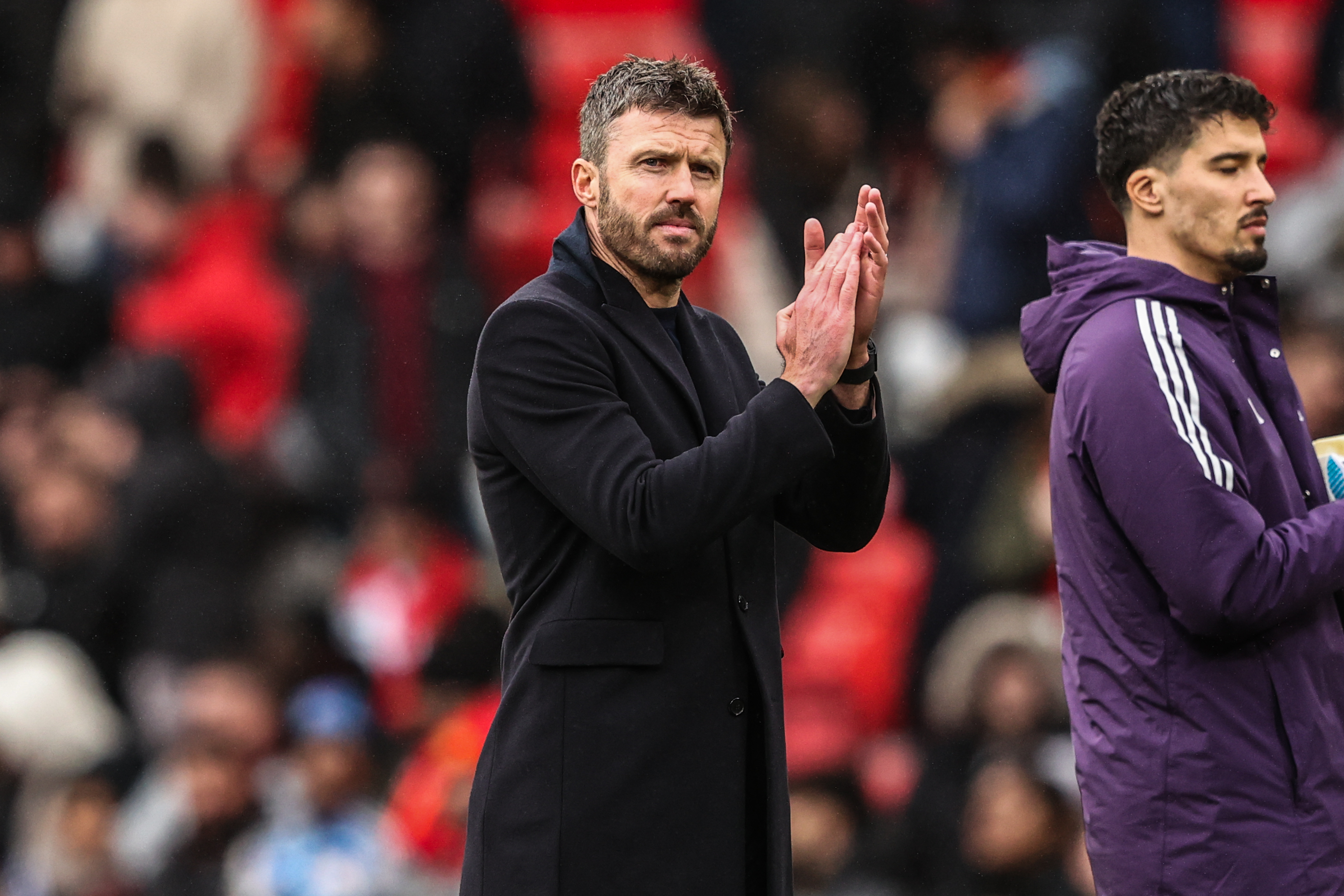 Michael Carrick applauding his team as we provide our Premier League predictions and expert picks for Matchweek 26. 