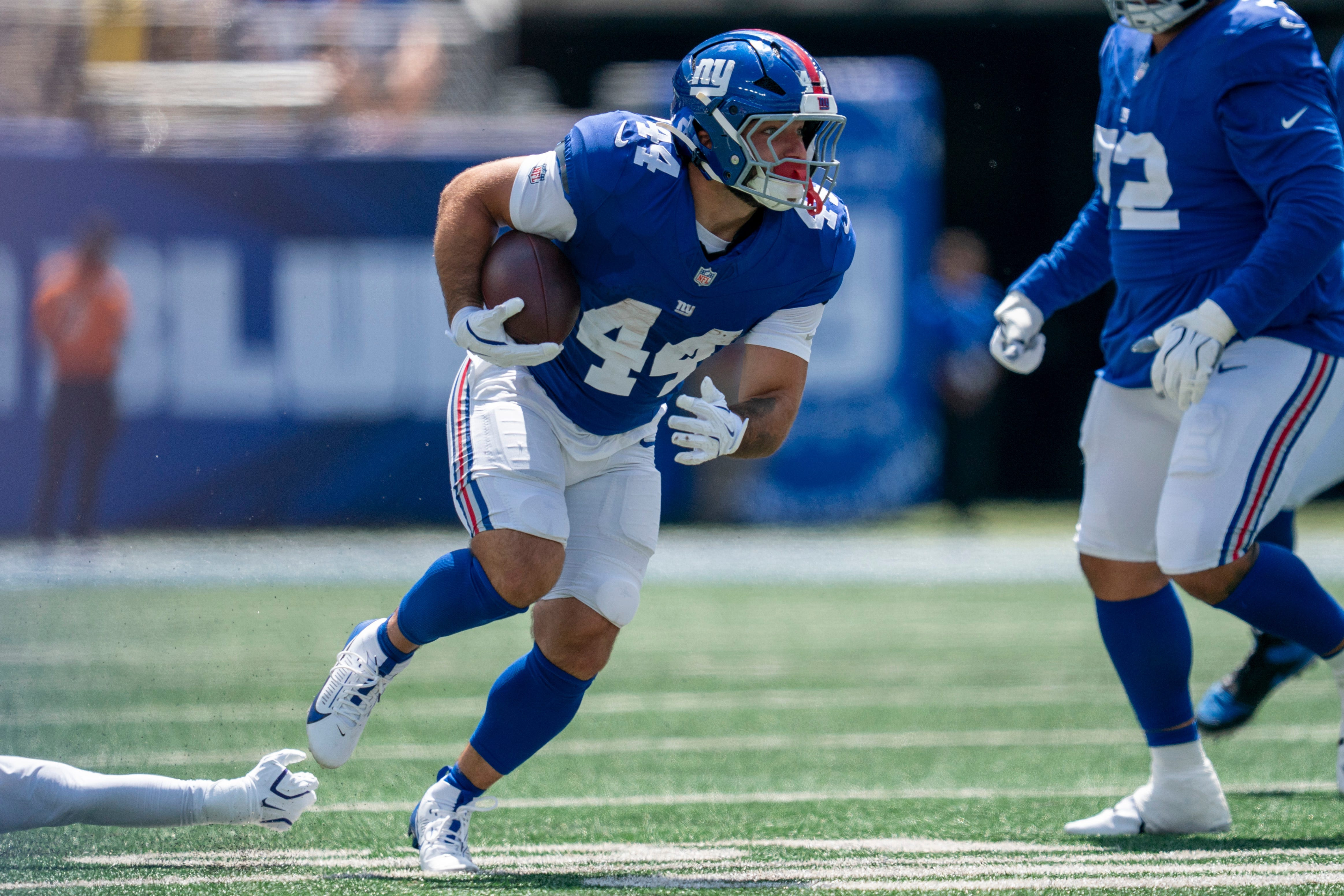 New York Giants running back Cam Skattebo (44) runs with the ball as he is featured in our Cowboys vs. Giants touchdown pick.