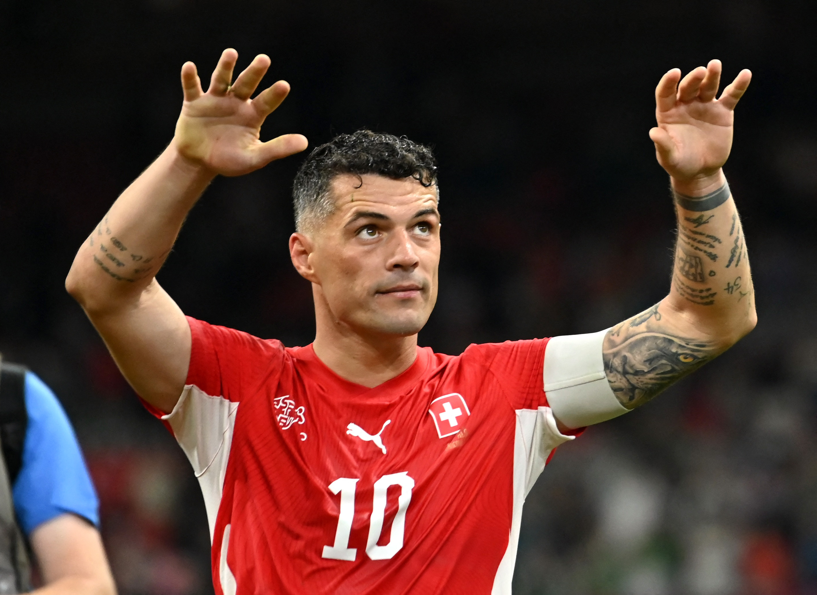 Switzerland's Granit Xhaka celebrates after a match while we look at Kalshi and Polymarket combined trading during the World Cup.