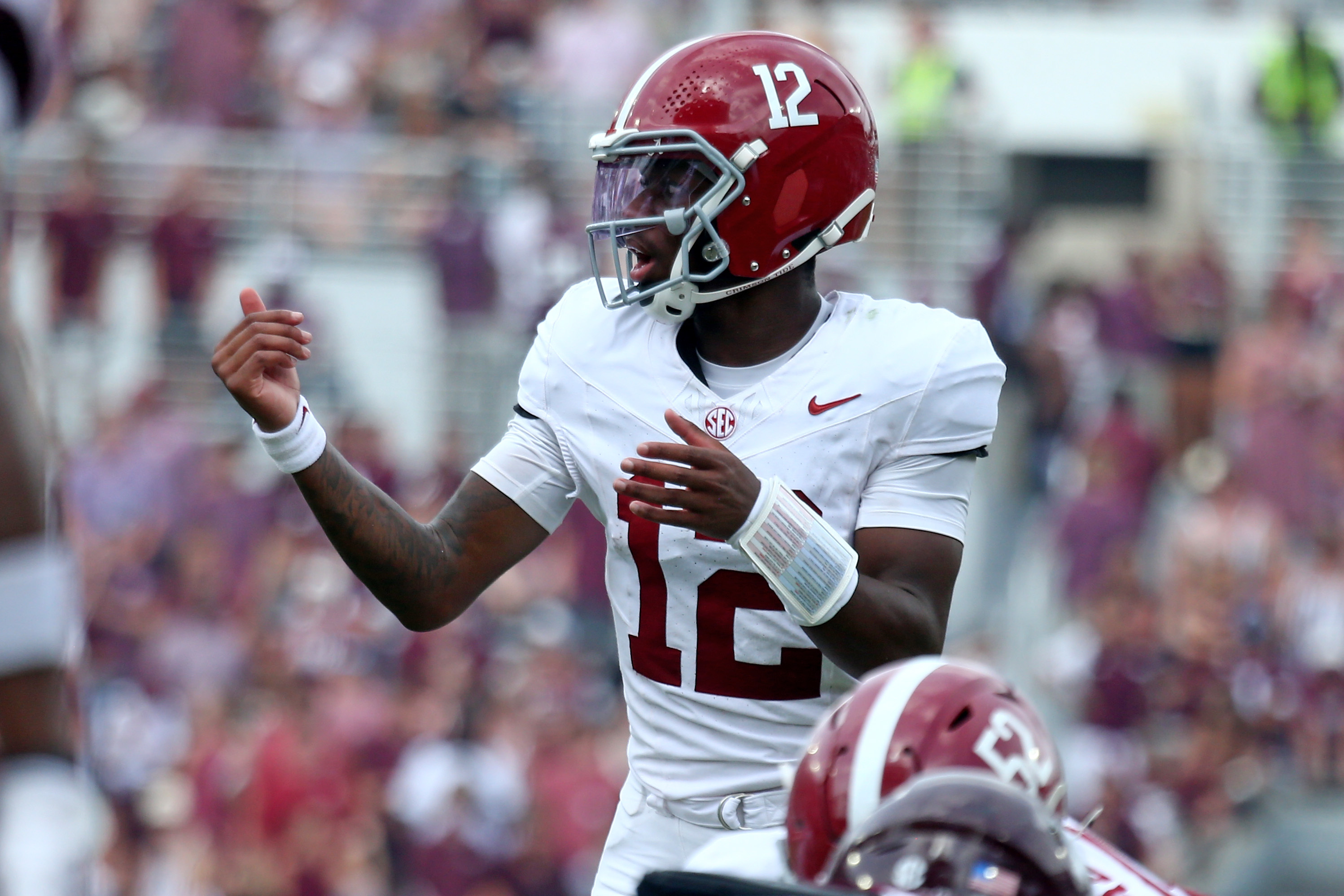Alabama Crimson Tide quarterback Keelon Russell (12) gives direction as he is featured in our Georgia vs. Alabama expert picks.