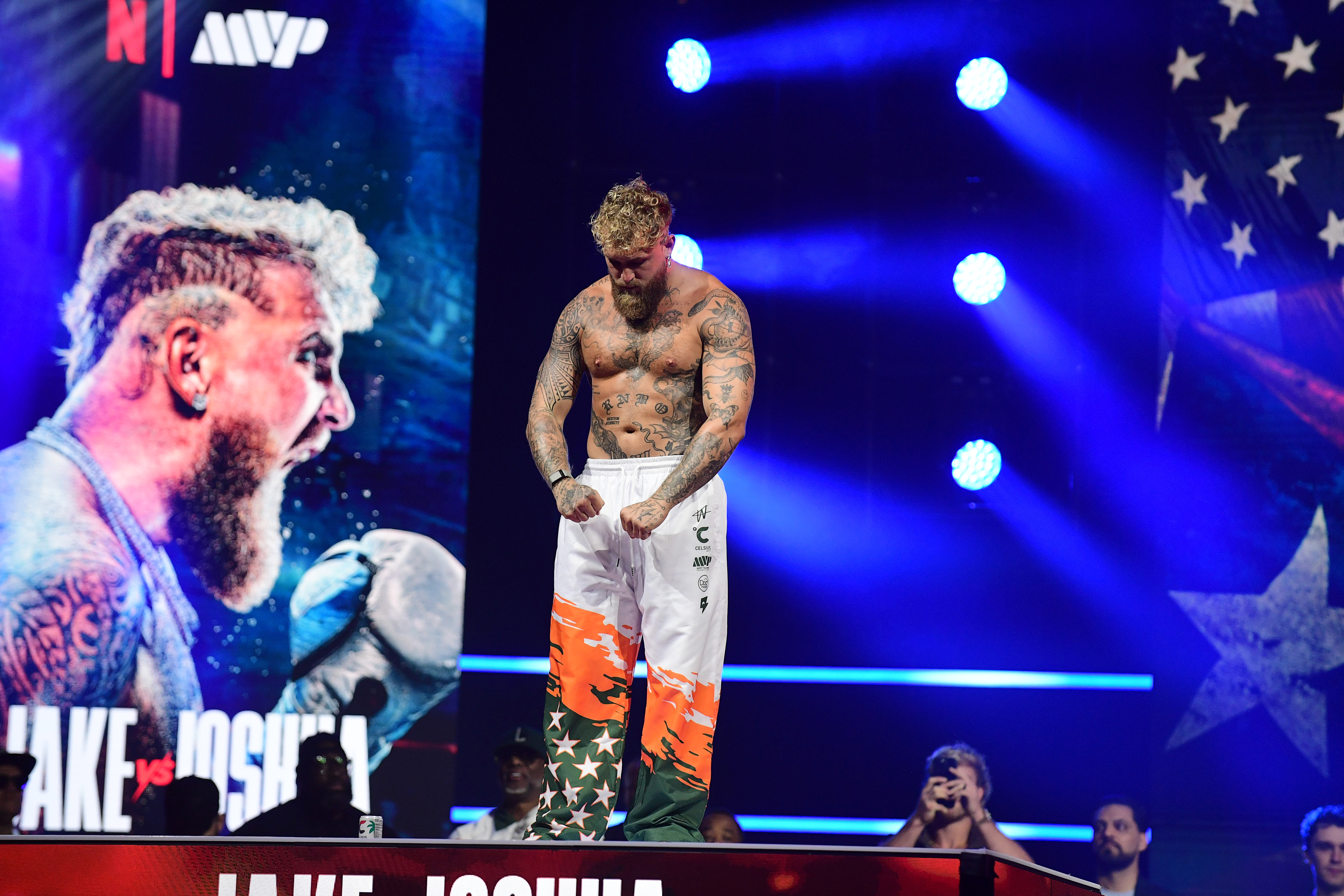 Jake Paul poses on the platform during the official weigh-in as we look at the betting odds for his fight with Anthony Joshua
