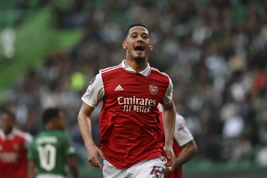 Arsenal defender William Saliba celebrates after scoring his team's first goal during the UEFA Europa League and we offer our best odds and picks for Fulham vs. Arsenal.