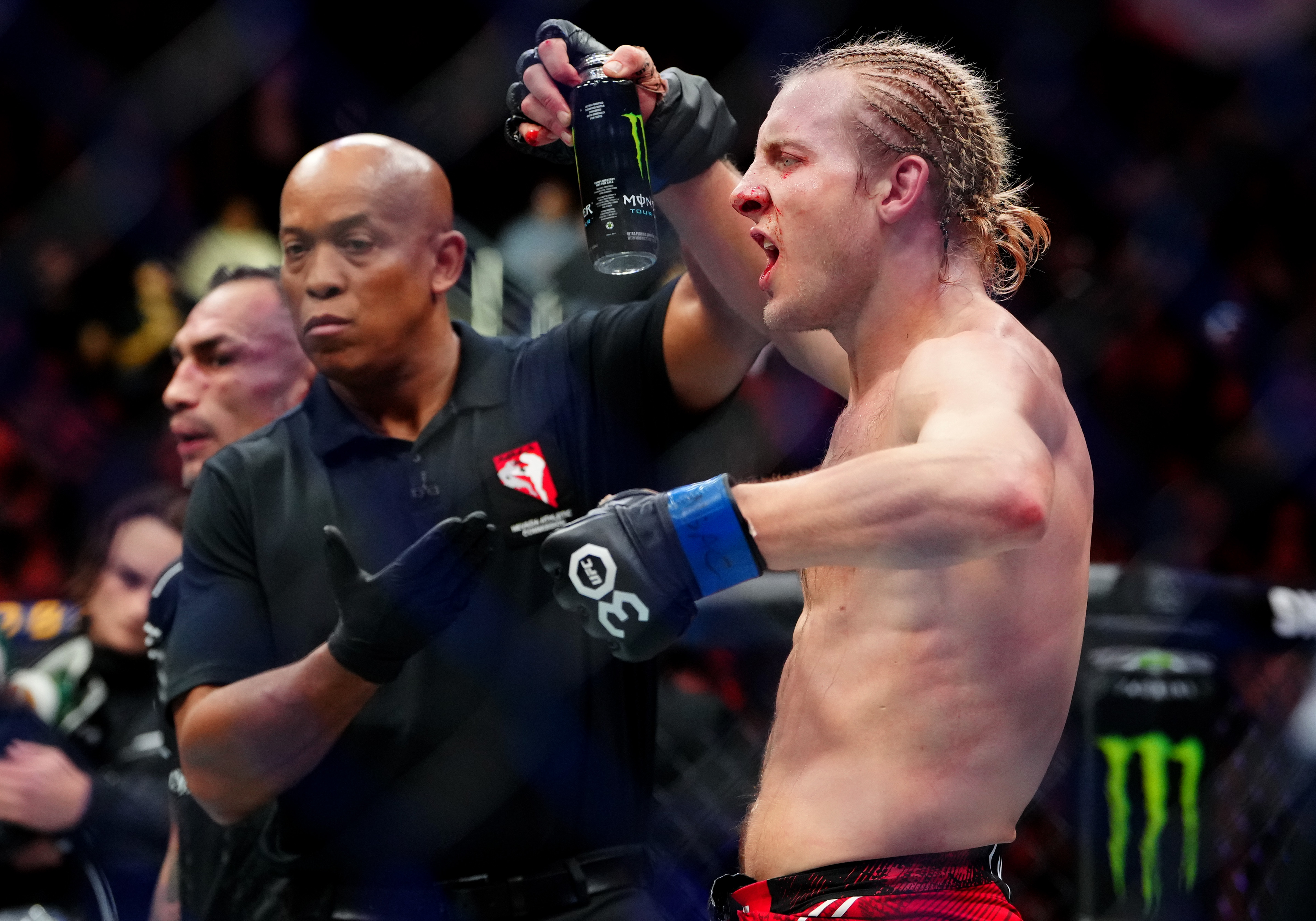 Paddy Pimblett (blue gloves) reacts as we break down the Gaethje vs. Pimblett odds.