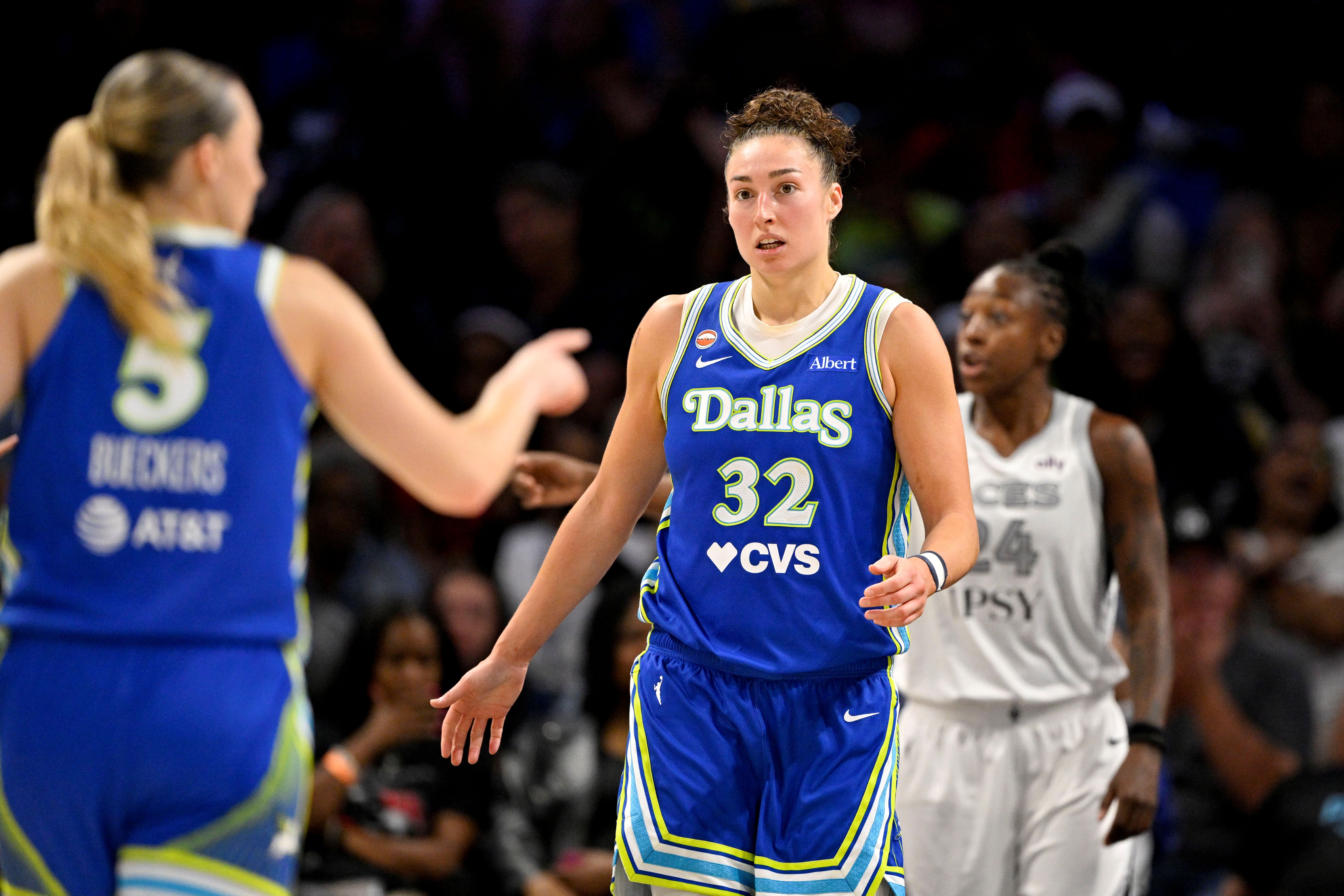 Dallas Wings guard Paige Bueckers (5) and forward Jessica Shepard (32) celebrate as we break down our Storm vs. Wings prediction today.