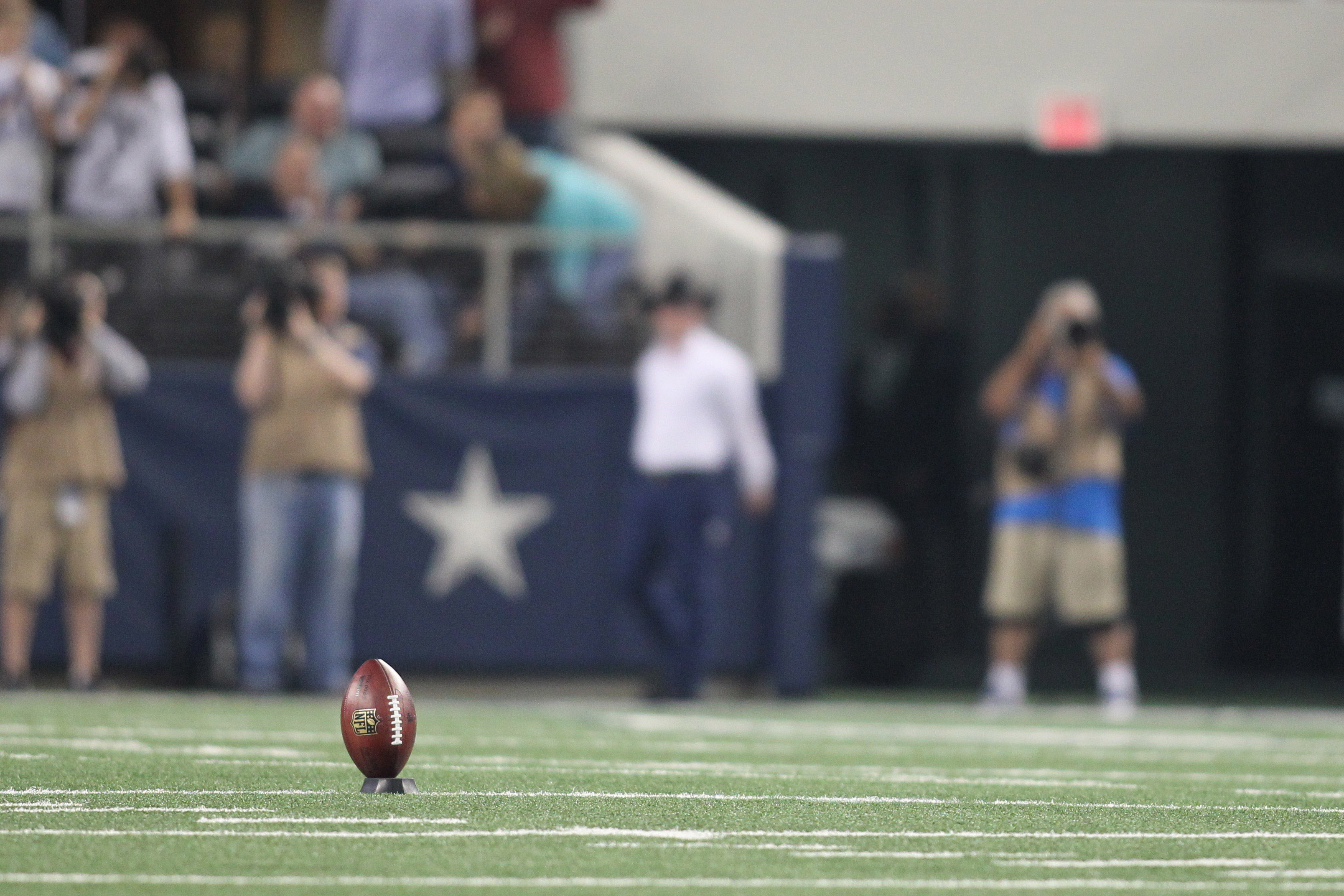 A general shot of a football on a tee as we look at the Super Bowl opening kickoff odds