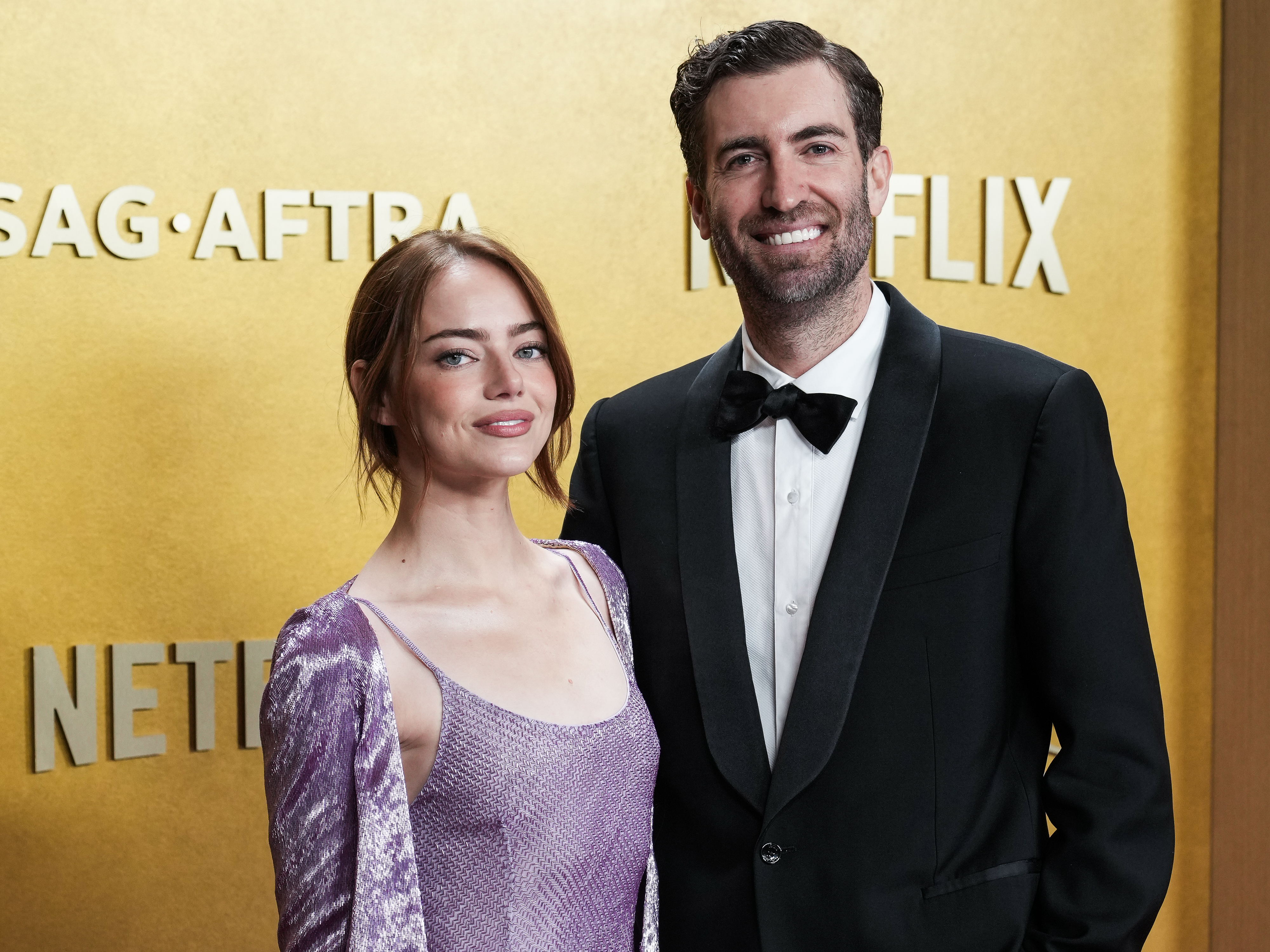 Emma Stone and Dave McCary walking on the red carpet as we look at our 2026 printable Oscars ballot