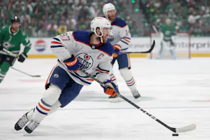 Connor McDavid of the Edmonton Oilers resets the offence against the Dallas Stars in the first period during Game 2 of the Western Conference Final. We're backing McDavid in our Stars vs. Oilers Predictions. 