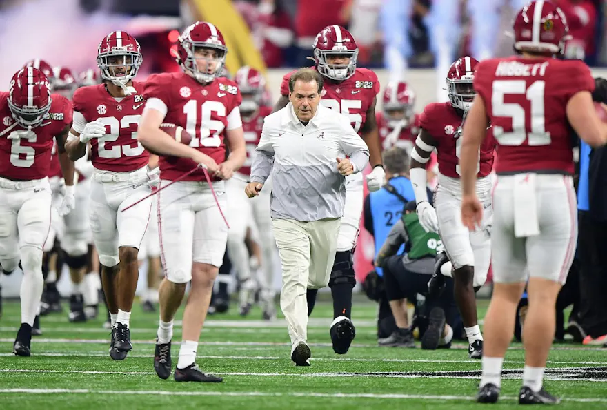 Head Coach Nick Saban of the Alabama Crimson Tide enters the field before the game against the Georgia Bulldogs during the 2022 CFP National Championship Game at Lucas Oil Stadium.
