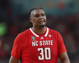 DJ Burns Jr. #30 of the North Carolina State Wolfpack walks across the court as we look at North Carolina's first month of sportsbook action