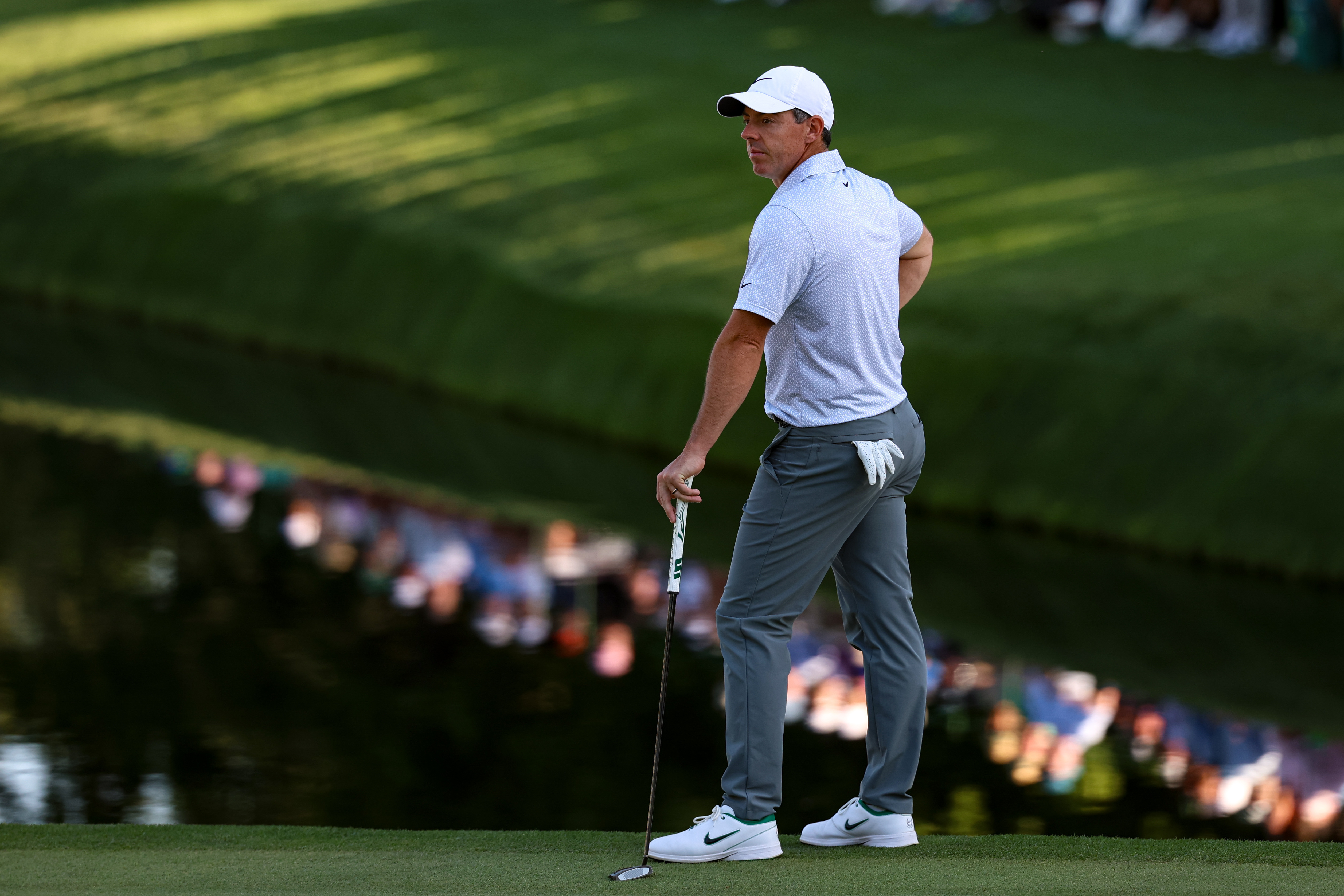 Rory McIlroy looks on as he stands on the edge of the 16th green as we break down our Masters Round 3 picks & predictions.