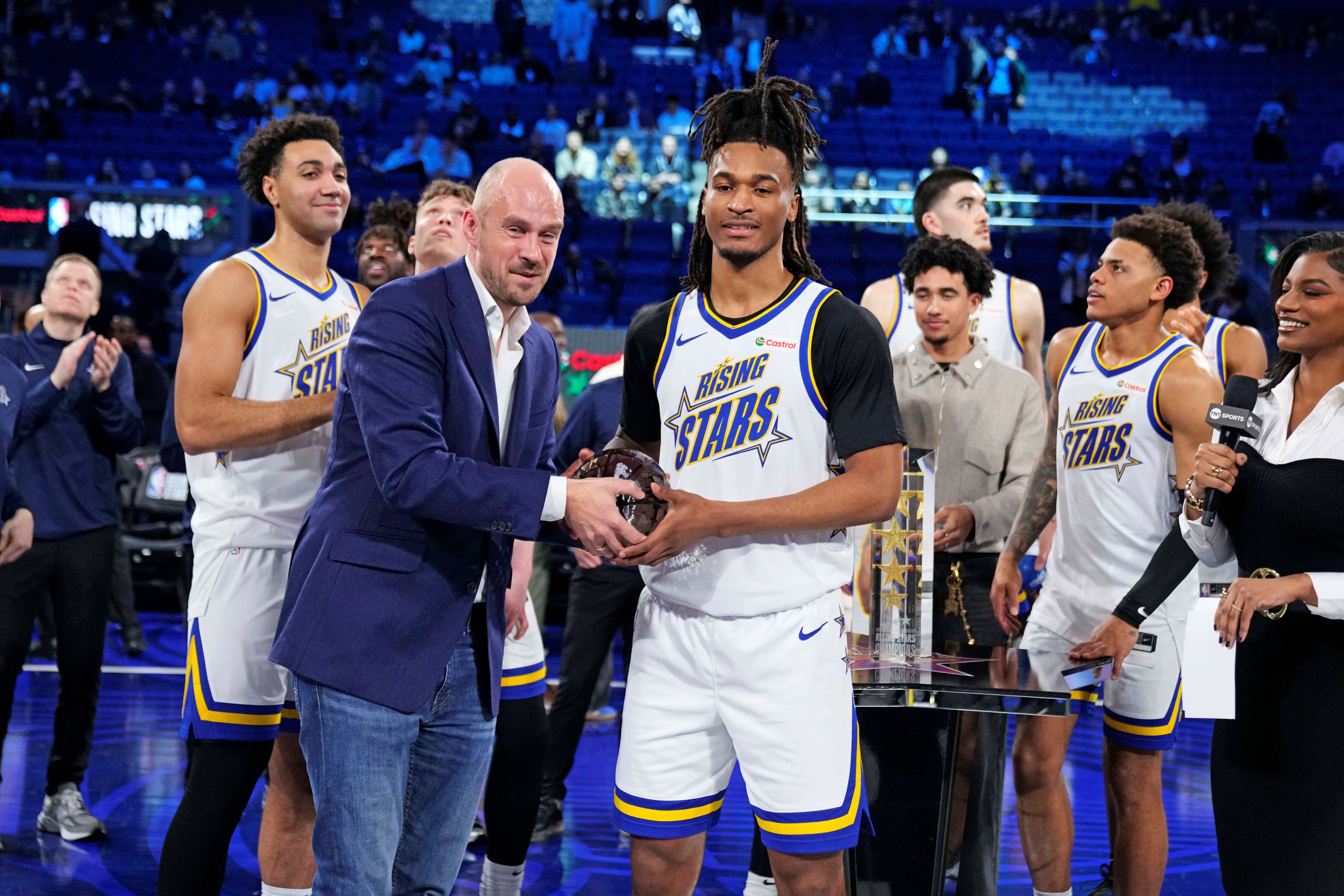 San Antonio Spurs guard Stephon Castle (5) holds a trophy as we dive into our NBA All-Star Weekend Rising Stars predictions.