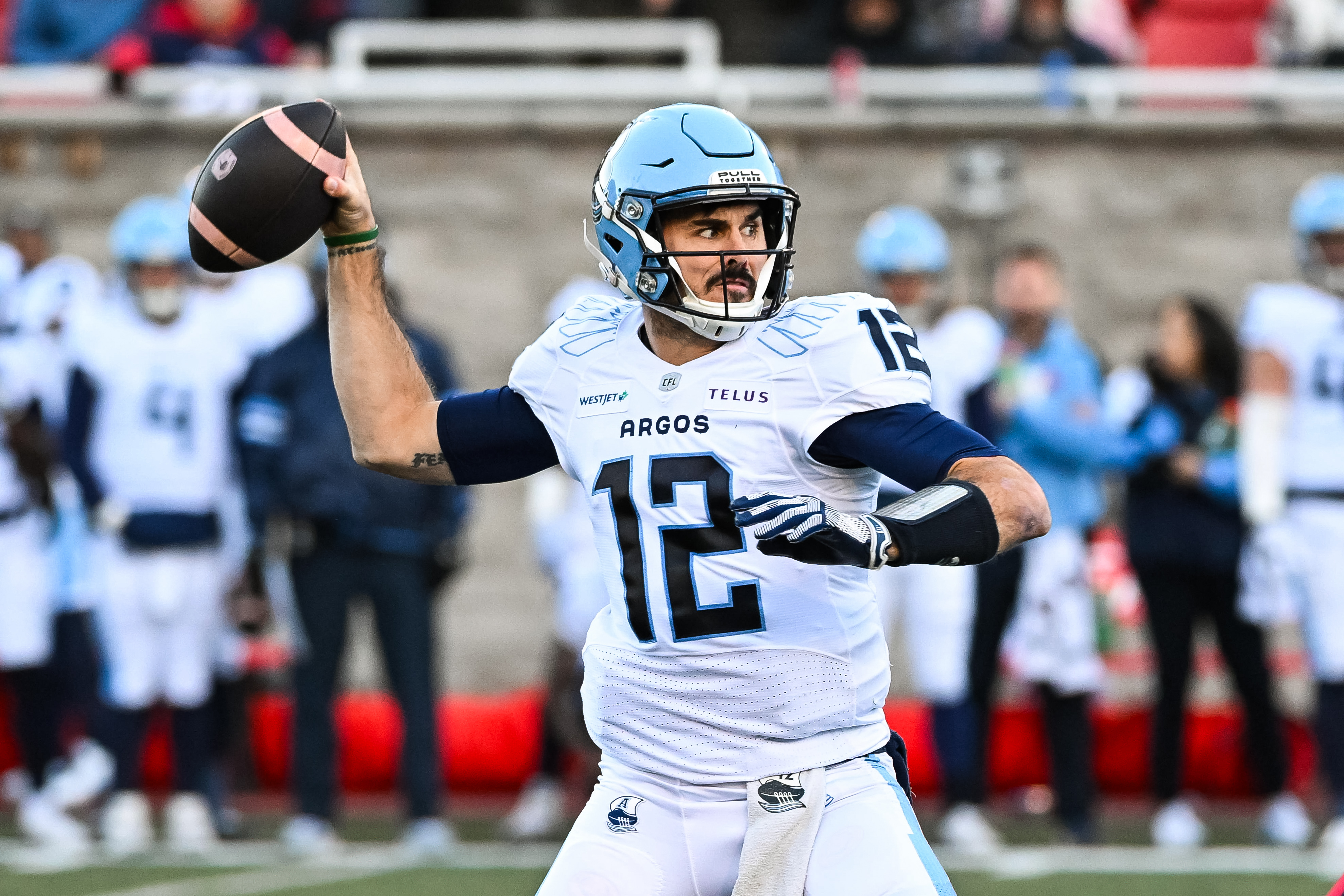 Toronto Argonauts quarterback Chad Kelly (12) passes the ball as we break down our Tiger-Cats vs. Argonauts prediction.