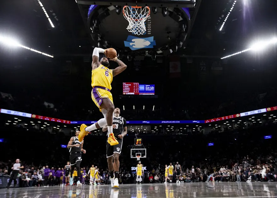 LeBron James of the Los Angeles Lakers dunks against the Brooklyn Nets at Barclays Center in the Brooklyn borough of New York City. Photo by Michelle Farsi/Getty Images via AFP.