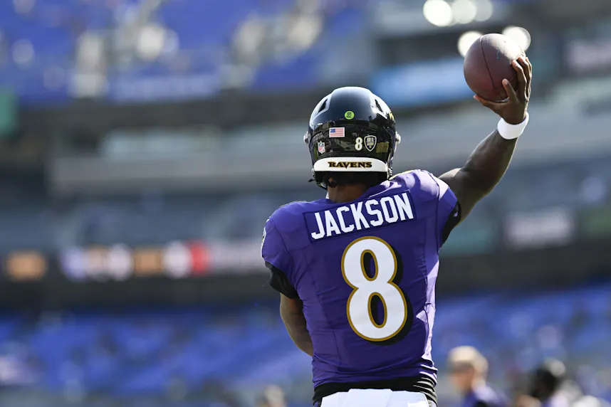 Baltimore Ravens quarterback Lamar Jackson throws before the game against the Washington Commanders.